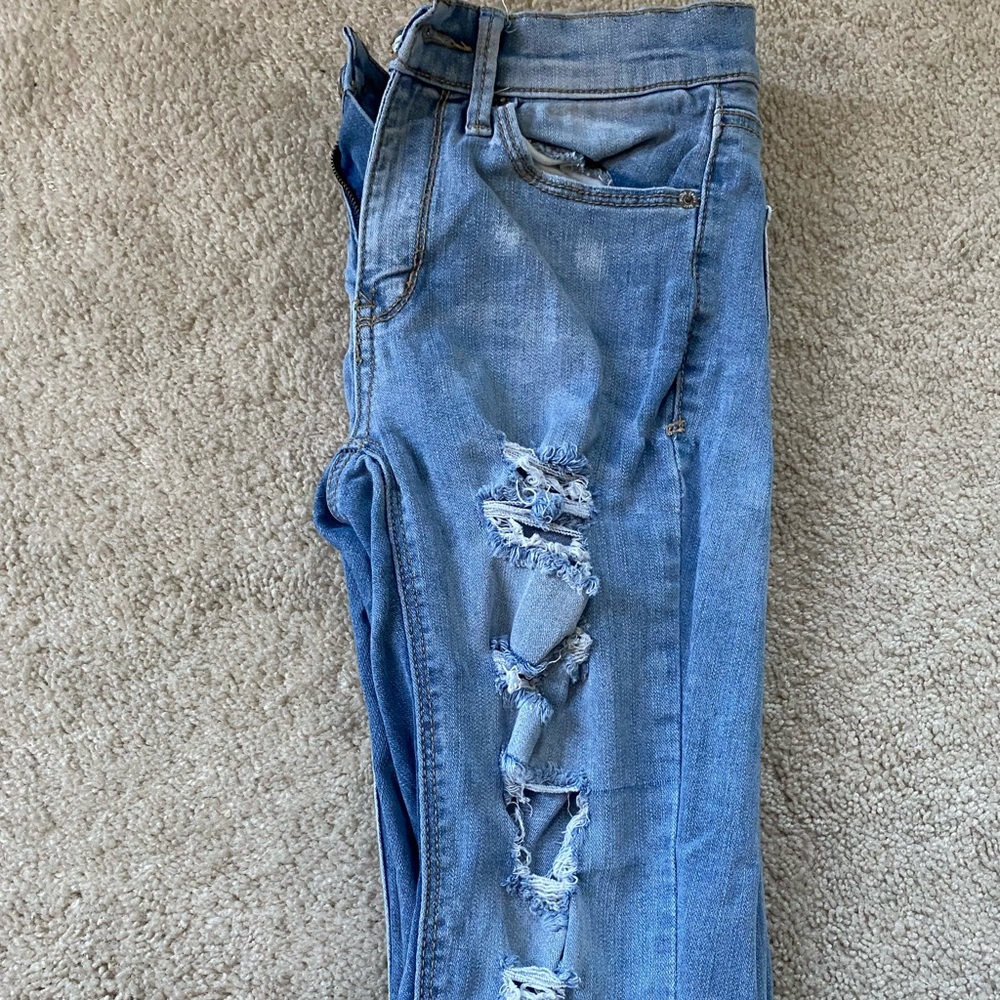 Light blue ripped jeans
